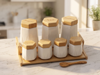 White hexagonal porcelain canisters for Tea, Coffee, Sugar and four Spice jars with bamboo lids – angled view