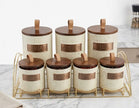 Serrana Glass Rustic Speckled Ceramic Canister Set 7pc — speckled cream ceramic with wooden lids and gold rack