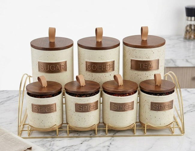 Serrana Glass Rustic Speckled Ceramic Canister Set 7pc — speckled cream ceramic with wooden lids and gold rack