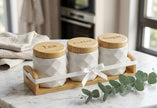 Serrana Glass Diamond Quilted Ceramic Canister Set of 3 — diamond quilted white ceramic with laser-engraved bamboo lids