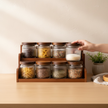 Serrana Glass Artisan Flute Two-Tier Glass Pantry Set — ribbed borosilicate jars with wooden lids on two-tier rack
