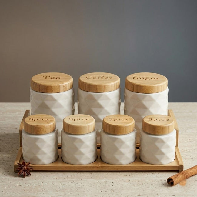 Serrana Glass Prism 7-Piece Countertop Suite — diamond-relief white ceramic canisters with bamboo lids on tiered tray